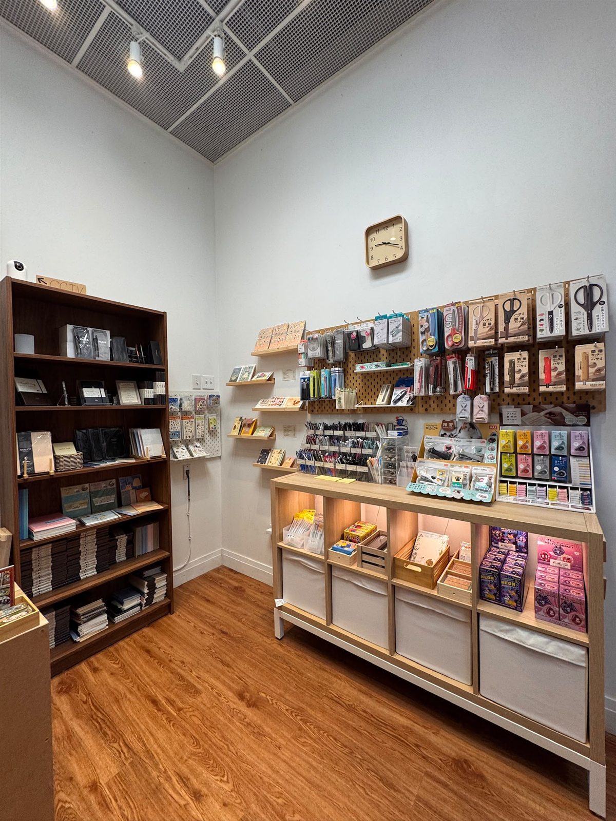Inside The Stationery Village with shelves of pens, scissors, stamps and memo pads